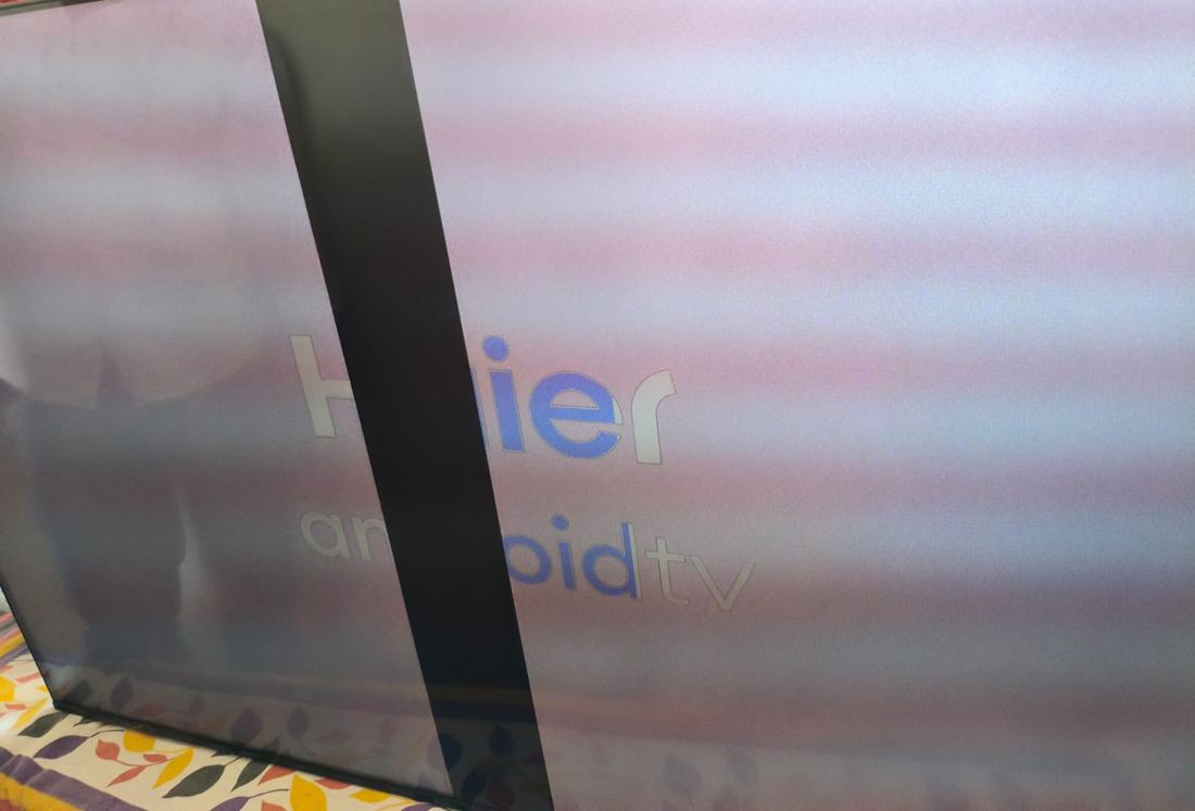 TV with a dark vertical band across the picture